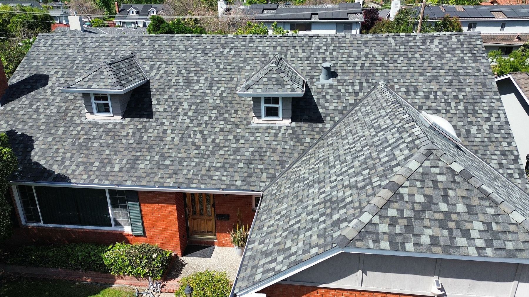Architectural shingle roof on a brick home in San Jose