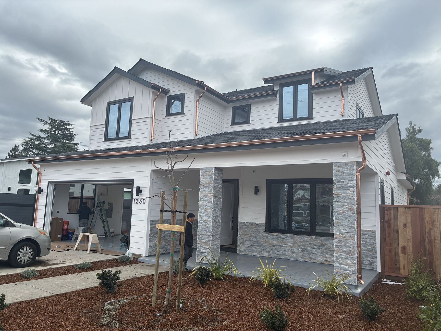New construction with copper gutters and downspouts by Keith Roofing