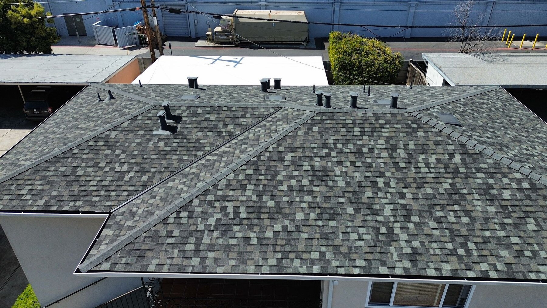 Campbell home with new 30-year Landmark composition shingle roof after tar-and-gravel conversion by Keith Roofing