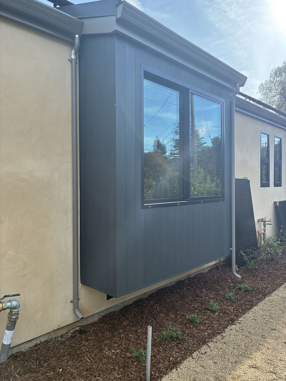 Custom half-round copper gutters on hillside estate