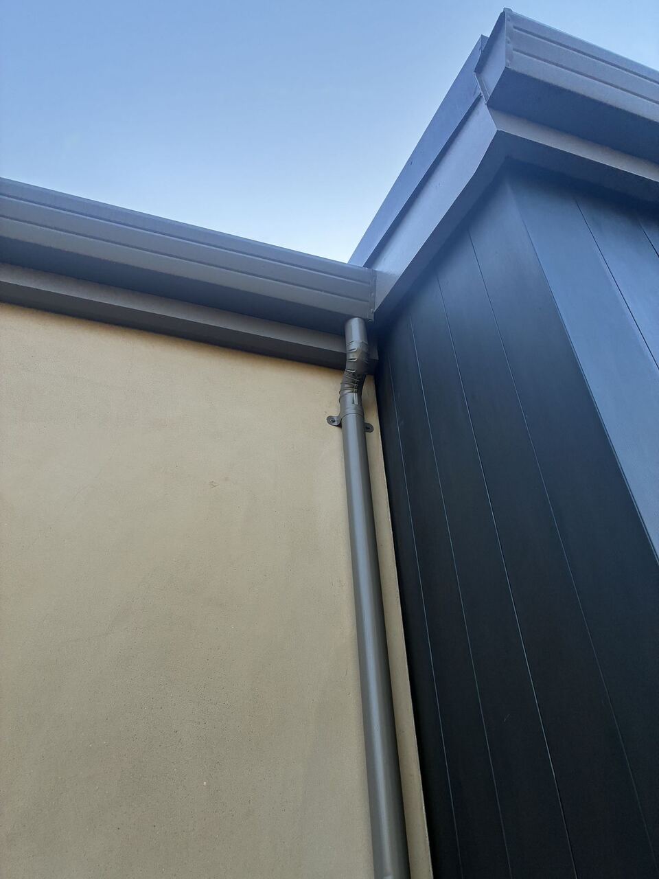 Inside corner gutter transition to round downspout detail