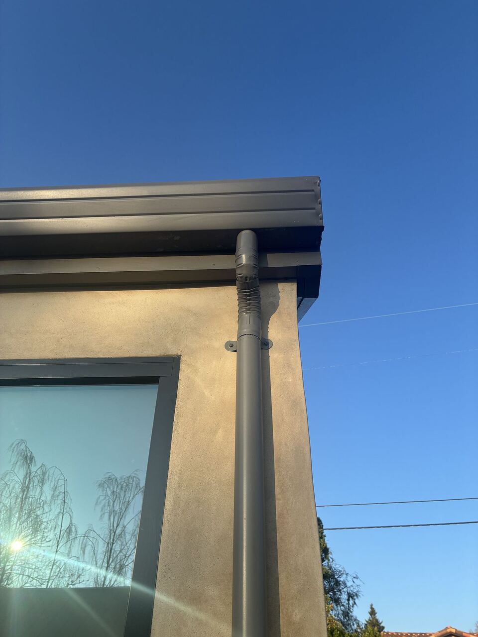 Gutter miter corner and downspout detail