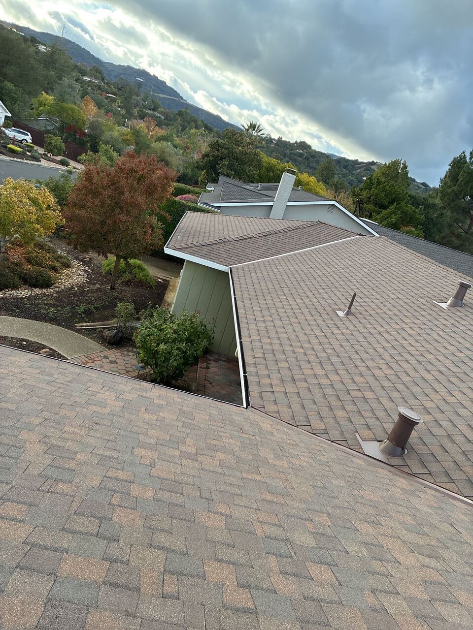 Saratoga hillside home — dramatic sky context