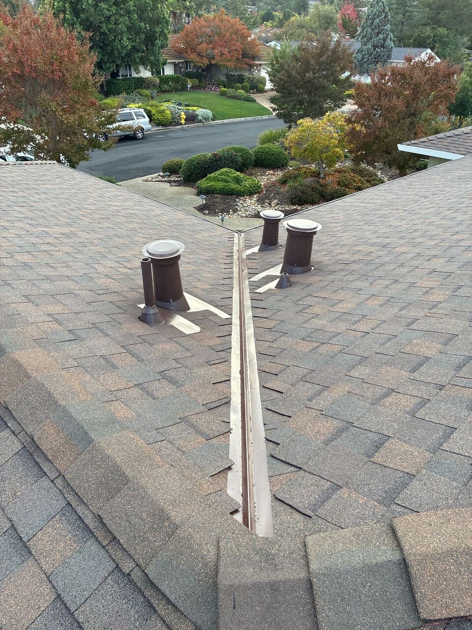 Open metal valley detail on Saratoga Landmark roof with color-matched vent boots