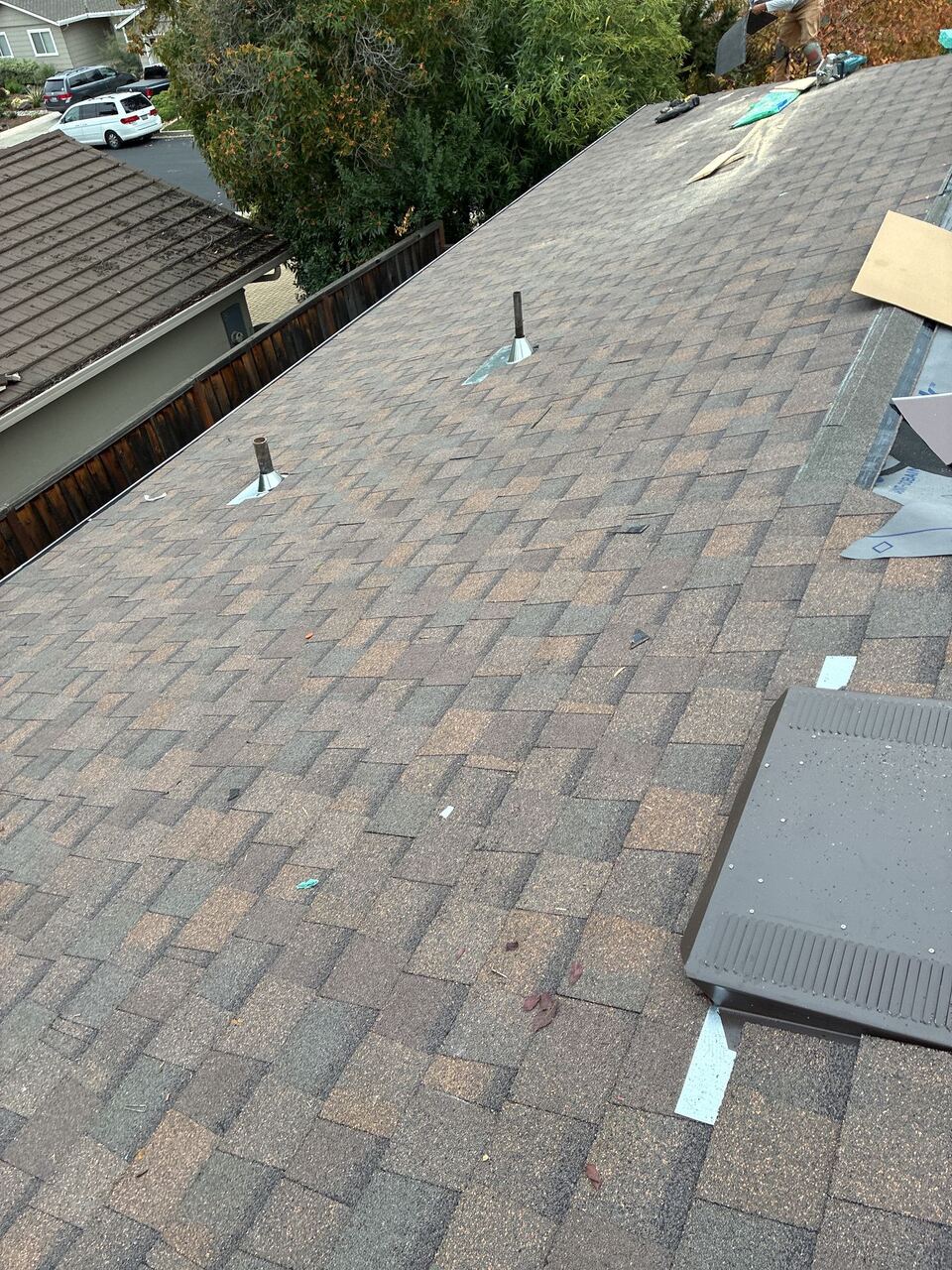 Landmark shingle installation in progress on Saratoga home with new box vent and pipe jacks