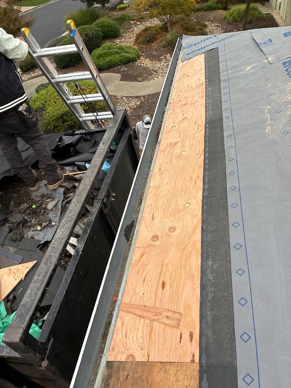 Tear-off and deck repair in progress during full re-roof