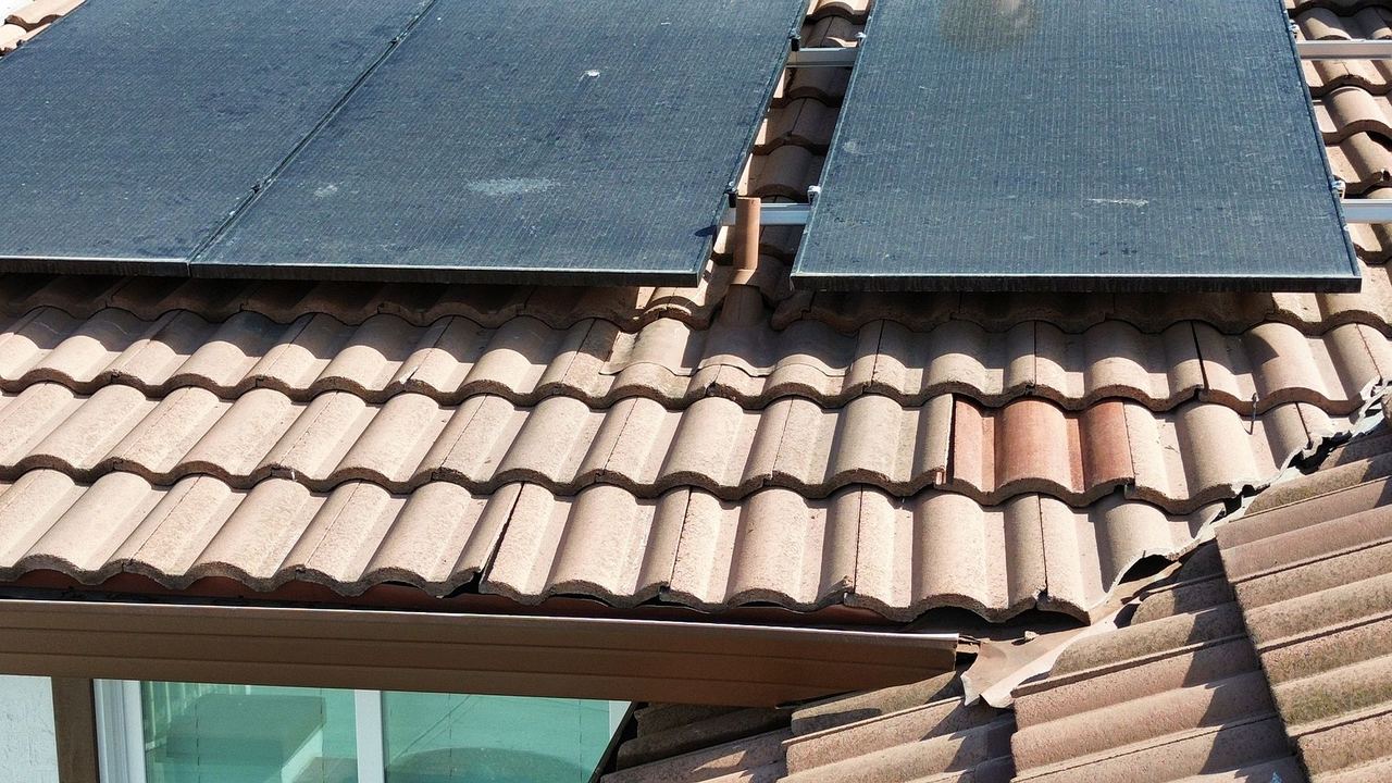 Solar panel and tile interface detail — gutter line
